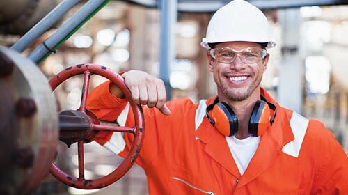 happy oil worker wearing orange